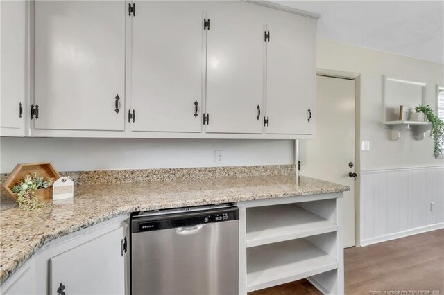 7517 Seaton Pl, Fayetteville, NC 28303 - kitchen featuring white cabinets, open shelves, dishwasher, wainscoting, and wood finished floors
