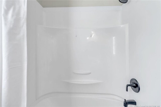 7517 Seaton Pl, Fayetteville, NC 28303 - interior details featuring shower / bath combo with shower curtain