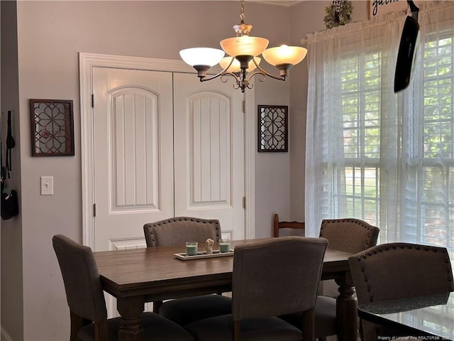 dining area with a chandelier