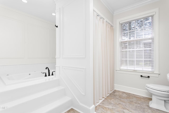 bathroom with plenty of natural light, baseboards, ornamental molding, and toilet
