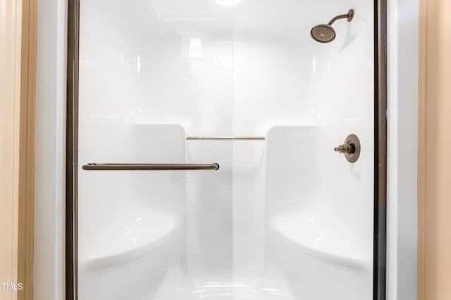 full bathroom featuring a stall shower