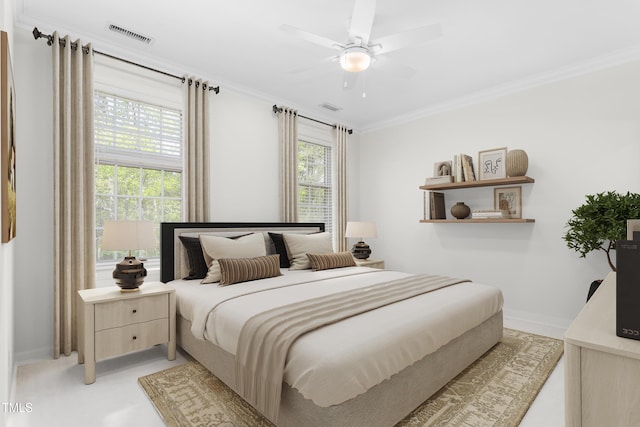 bedroom with visible vents, ornamental molding, baseboards, and a ceiling fan