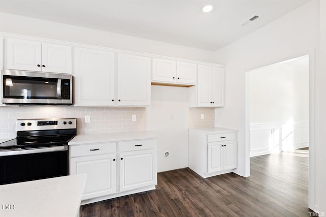 kitchen with white cabinets, light countertops, visible vents, and stainless steel appliances