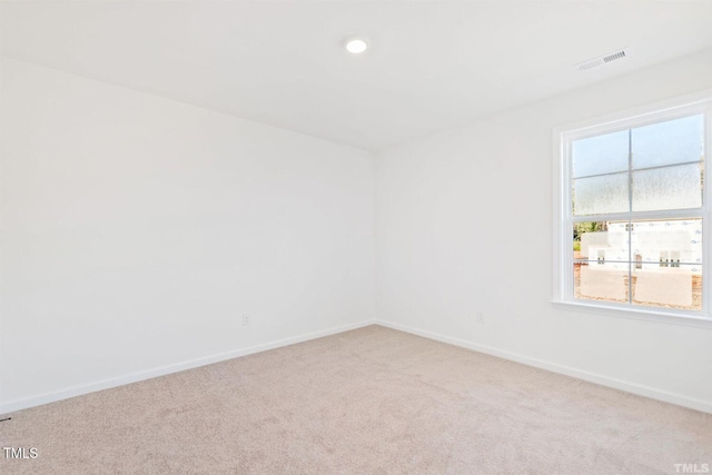 empty room with recessed lighting, visible vents, baseboards, and carpet floors