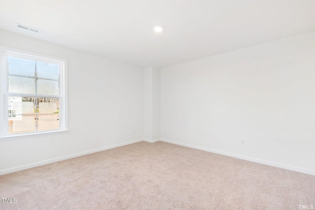 unfurnished room with recessed lighting, visible vents, baseboards, and carpet floors