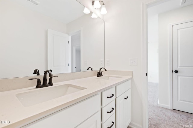 full bathroom with double vanity, a sink, and visible vents
