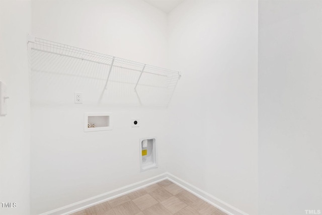 laundry area featuring electric dryer hookup, baseboards, washer hookup, laundry area, and light floors