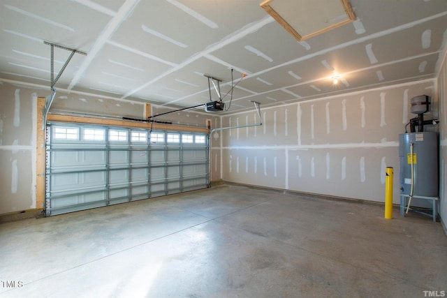 garage with water heater and a garage door opener