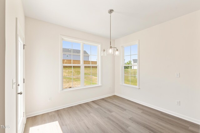 40 Rosewood Ln, Youngsville, NC 27596 - spare room with light wood-type flooring and baseboards