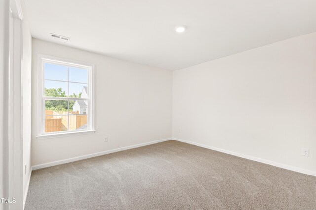 40 Rosewood Ln, Youngsville, NC 27596 - carpeted empty room featuring baseboards