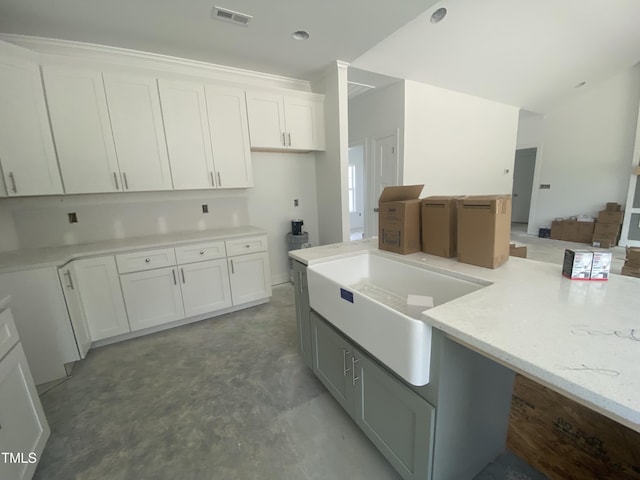 102 Rae Dr, Pikeville, NC 27863 - kitchen with white cabinets, light stone countertops, concrete flooring, and open floor plan