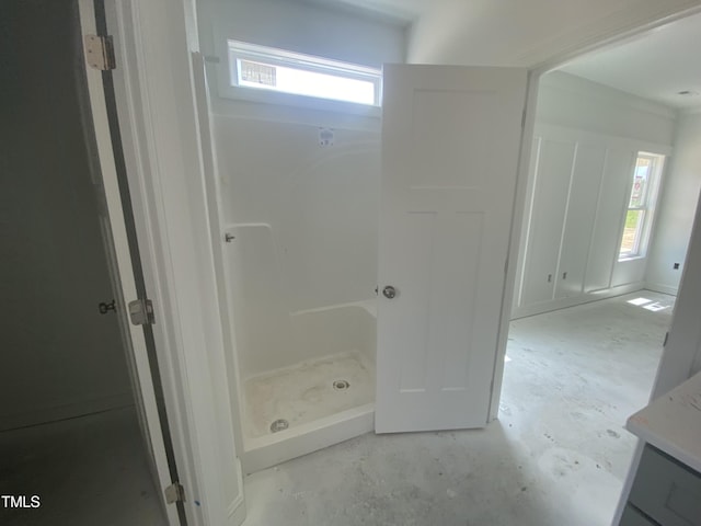 102 Rae Dr, Pikeville, NC 27863 - bathroom with vanity, a shower, and unfinished concrete flooring