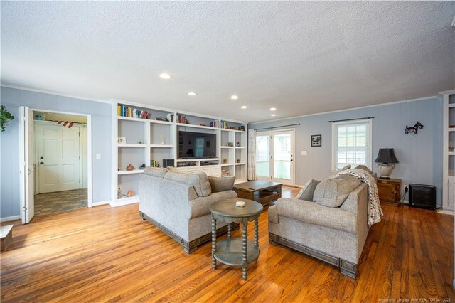 211 Edgewood Ave, Clinton, NC 28328 - living room with a textured ceiling, crown molding, and wood finished floors