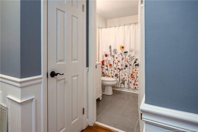 211 Edgewood Ave, Clinton, NC 28328 - full bathroom with a shower with shower curtain, tile patterned flooring, and toilet