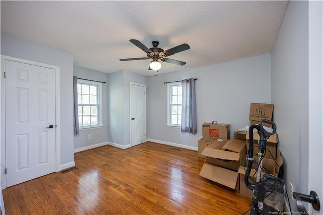 211 Edgewood Ave, Clinton, NC 28328 - living area with visible vents, baseboards, ceiling fan, and wood finished floors