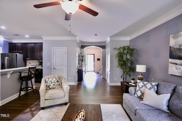 126 Willow Weald Ct, Fuquay Varina, NC 27526 - living room featuring arched walkways, a ceiling fan, crown molding, light wood finished floors, and decorative columns