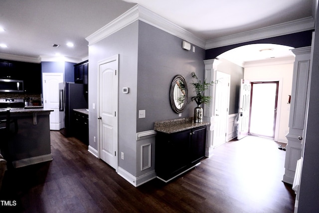 126 Willow Weald Ct, Fuquay Varina, NC 27526 - hallway with dark wood-style floors, arched walkways, decorative columns, crown molding, and recessed lighting