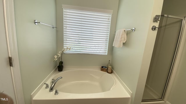 126 Willow Weald Ct, Fuquay Varina, NC 27526 - bathroom with a shower stall and a garden tub