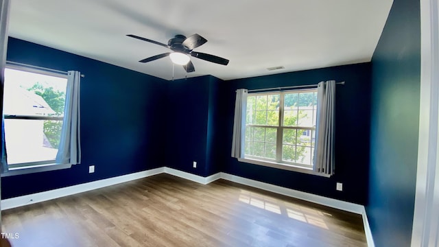 126 Willow Weald Ct, Fuquay Varina, NC 27526 - spare room featuring wood finished floors, baseboards, and a ceiling fan