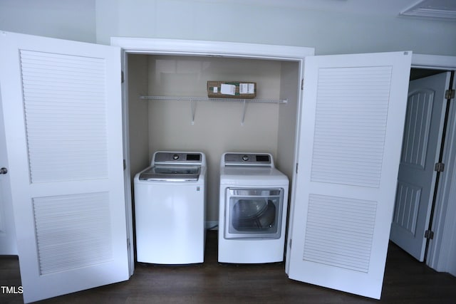 126 Willow Weald Ct, Fuquay Varina, NC 27526 - laundry room with washing machine and dryer and dark wood-type flooring