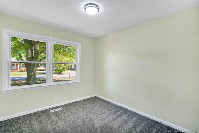 3014 Akron Dr, Hope Mills, NC 28348 - carpeted spare room featuring visible vents, baseboards, and a textured ceiling