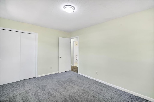 3014 Akron Dr, Hope Mills, NC 28348 - unfurnished bedroom with a closet, baseboards, and carpet floors