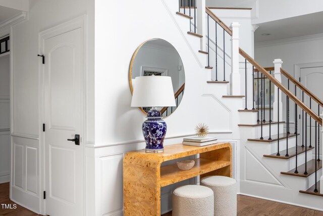 123 Trellingwood Dr, Morrisville, NC 27560 - staircase with wood finished floors and ornamental molding