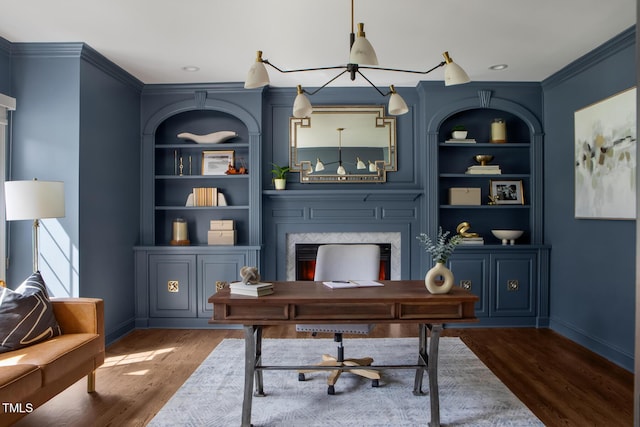 123 Trellingwood Dr, Morrisville, NC 27560 - office with ornamental molding, a fireplace, wood finished floors, and built in shelves