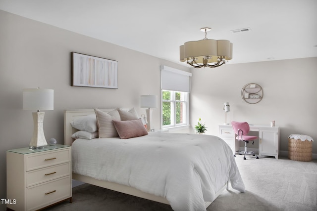 123 Trellingwood Dr, Morrisville, NC 27560 - bedroom featuring dark carpet and a chandelier