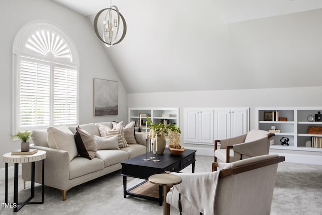 123 Trellingwood Dr, Morrisville, NC 27560 - living area featuring lofted ceiling, built in features, healthy amount of natural light, light colored carpet, and a chandelier