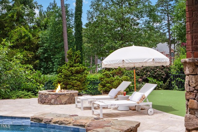 123 Trellingwood Dr, Morrisville, NC 27560 - view of patio / terrace featuring an outdoor fire pit