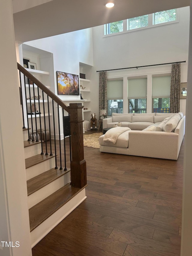 127 Sanderway Dr, Chapel Hill, NC 27516 - living room with a high ceiling, stairs, and dark wood-style flooring