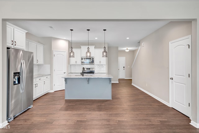 41 Willow Green Dr, Clayton, NC 27527 - kitchen featuring stainless steel appliances, dark wood finished floors, white cabinets, and decorative backsplash