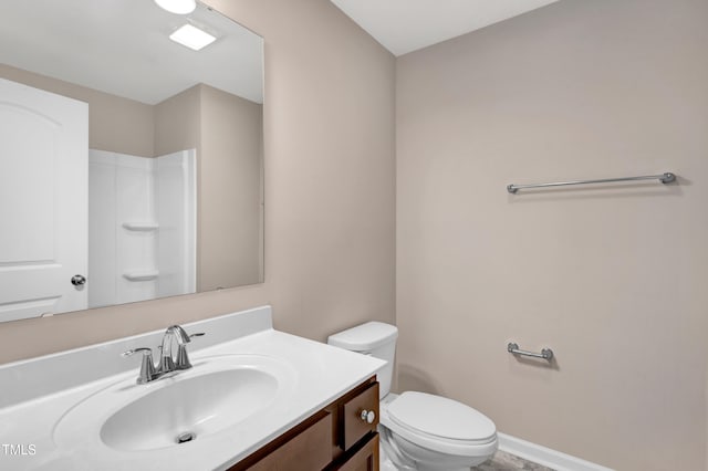 41 Willow Green Dr, Clayton, NC 27527 - bathroom with toilet, vanity, baseboards, and a shower