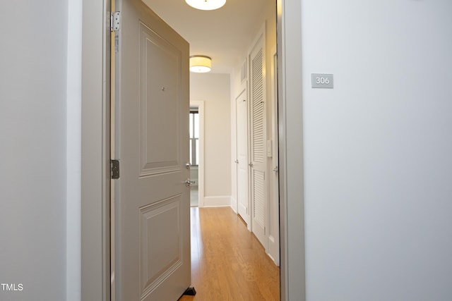 hall with light wood-style floors