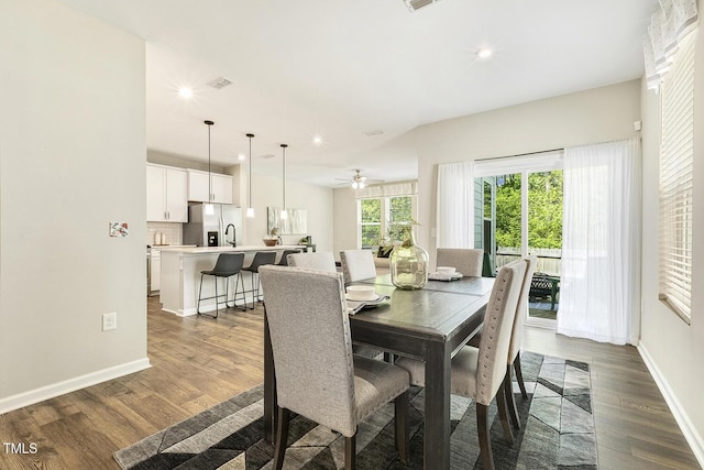 dining area featuring baseboards, recessed lighting, and dark wood-style floors