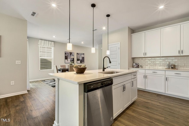 kitchen with recessed lighting, visible vents, dark wood finished floors, dishwasher, and a sink