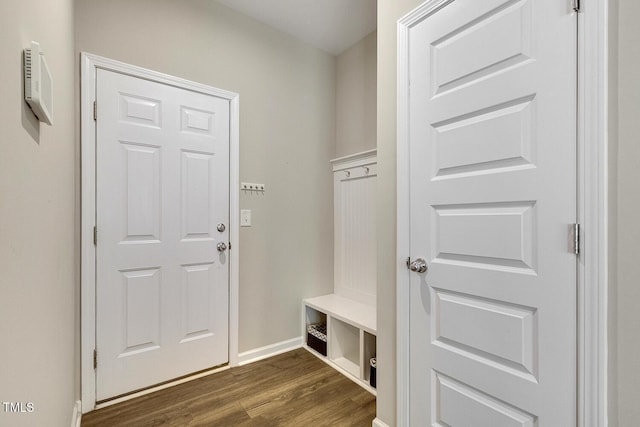 mudroom with baseboards and dark wood finished floors