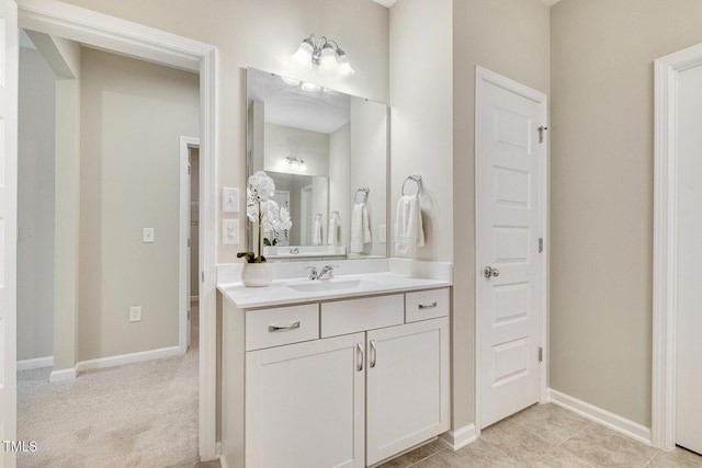 bathroom featuring vanity and baseboards
