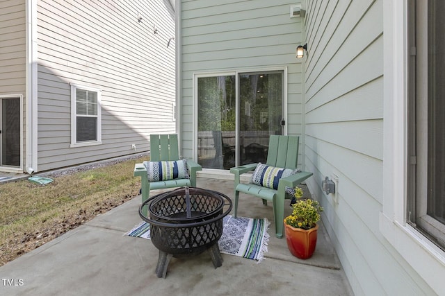 view of patio / terrace with a fire pit