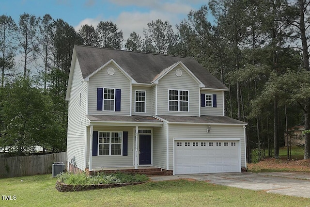 traditional-style house featuring central air condition unit, driveway, a front yard, a garage, and fence