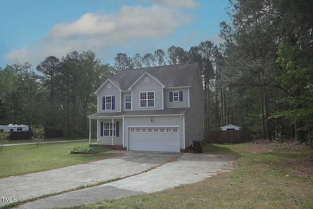traditional-style home featuring an attached garage, driveway, fence, and a front lawn