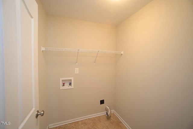 clothes washing area featuring baseboards, carpet, laundry area, and washer hookup