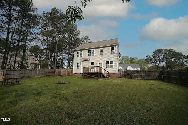 back of house with a yard, a deck, a fenced backyard, and crawl space