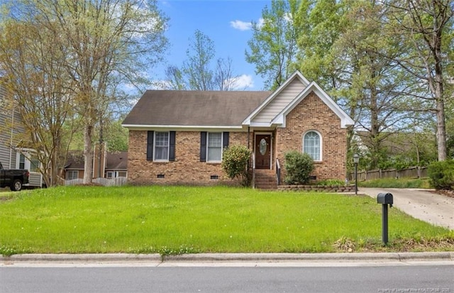ranch-style home featuring crawl space, a front yard, fence, and brick siding