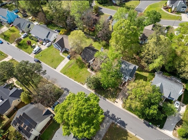 birds eye view of property with a residential view