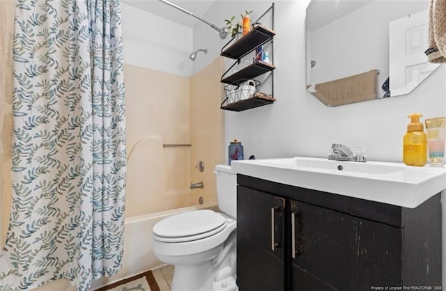 full bath with tile patterned flooring, shower / tub combo, vanity, and toilet