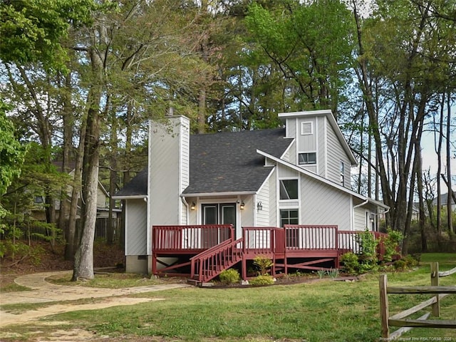 494 Wilder Dr, Fayetteville, NC 28314 - view of front facade featuring a wooden deck, crawl space, a front lawn, a chimney, and a shingled roof