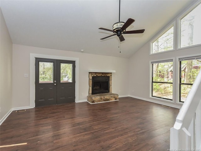 494 Wilder Dr, Fayetteville, NC 28314 - unfurnished living room featuring dark wood-type flooring, baseboards, and a healthy amount of sunlight