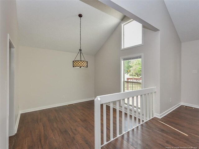 494 Wilder Dr, Fayetteville, NC 28314 - hall with visible vents, baseboards, wood finished floors, and lofted ceiling
